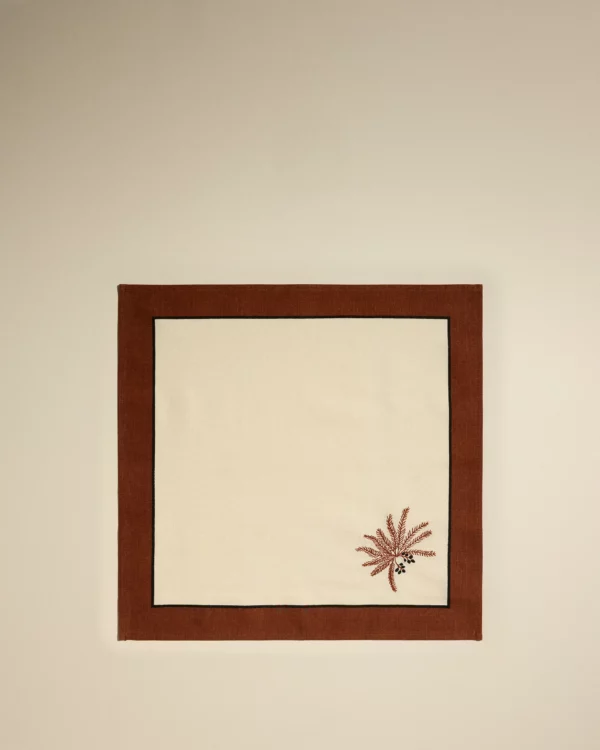 Duo de serviettes de table Phoenix terracotta, en coton avec broderie palmier, parfait pour une décoration de table estivale élégante.