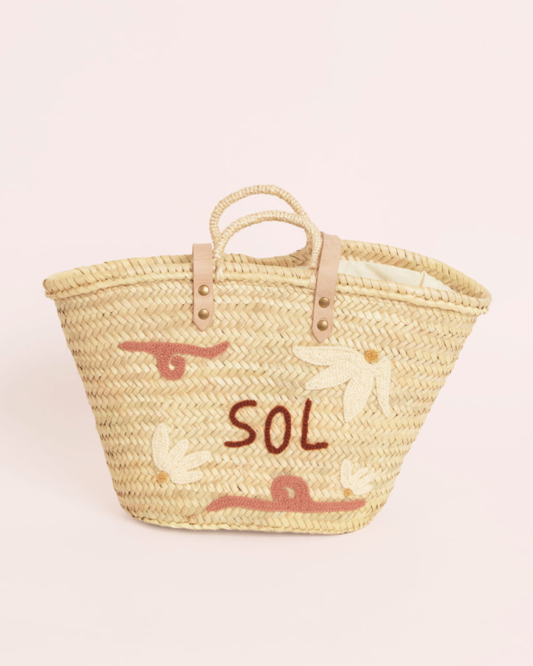Panier brodé El Sol Rose Maradji en paille tressée avec anses en cuir et broderie rose en laine