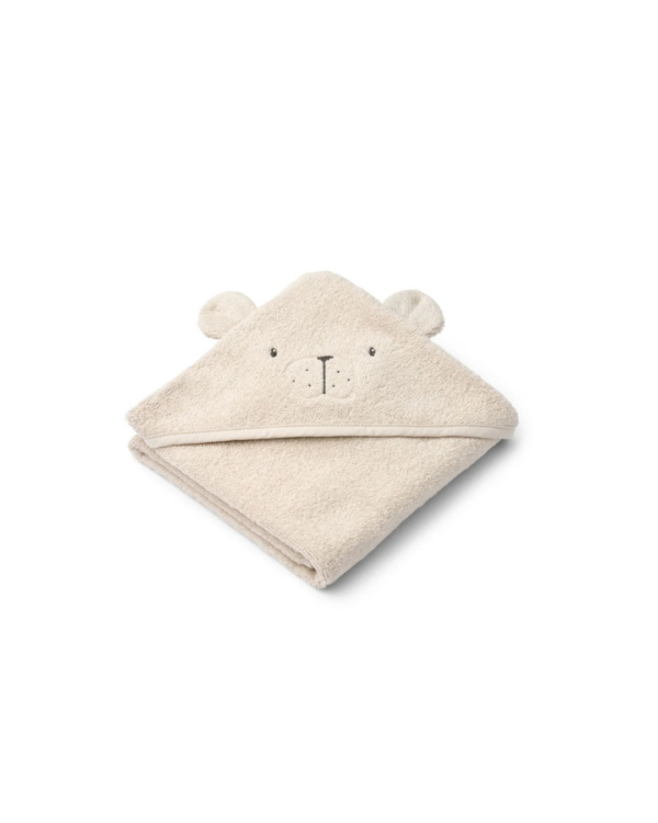 Bébé enveloppé dans une serviette à capuche en coton biologique ALBERT, idéale pour la sortie de bain