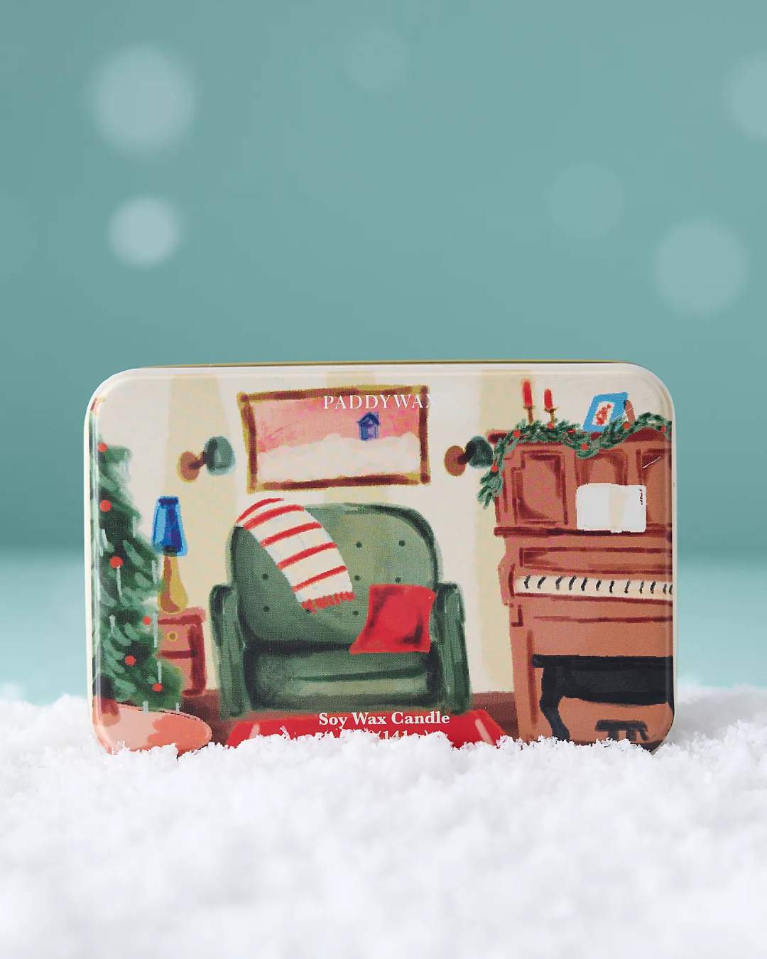 Bougie boîte métal Noël Piano parfum Grenade & Épicéa, bougie festive en cire de soja illustrée.