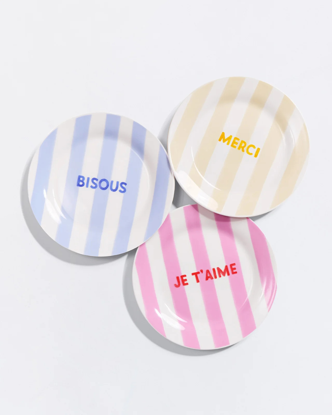 Assiette rayée jaune Merci en porcelaine 19 cm avec motif pastel et inscription décorative