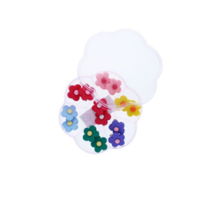 Boîte à bijoux en forme de fleur avec 7 paires de boucles d'oreilles à clips colorées.