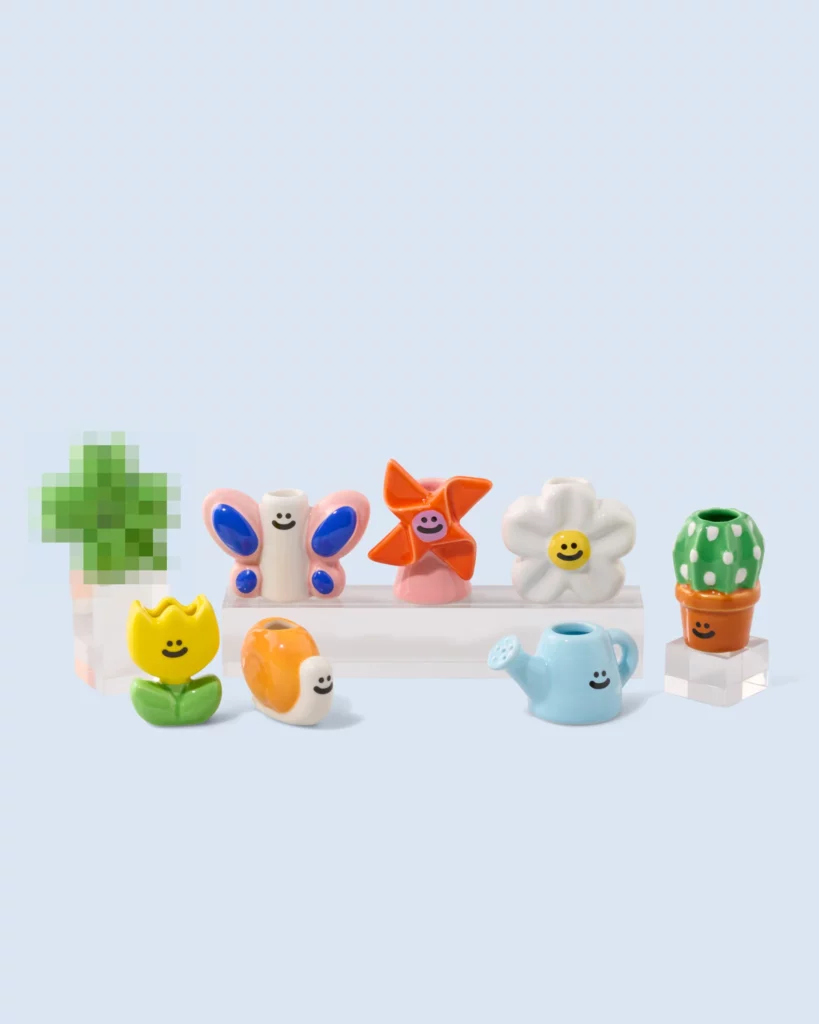Surprise Box Garden Fluid Market contenant un mini vase en céramique.