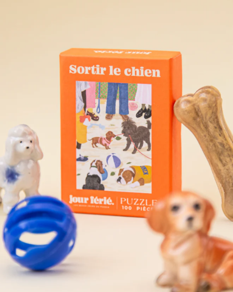 Mini puzzle 100 pièces Sortir le Chien illustrant une promenade avec un chien.